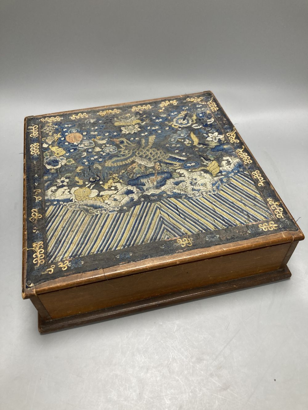 A Chinese circular silk roundel, 44cm and a Chinese kesi rank badge later attached to a box and a machine tapestry